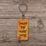 Dekhle Hobe Khorcha Ache Hand-Painted Wooden Keyring image