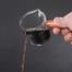Measuring Cup With Wooden Handle image