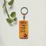 Natok Kom Koro Pio Hand-Painted Wooden Keyring image
